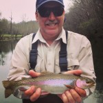 Dave with a nice Watauga river rainbow trout while fishing with Huck