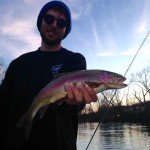 Jordan with a beautiful Watauga river rainbow trout while fishing with Huck