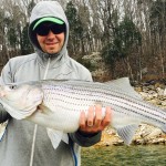 Pete with a Boone lake striper fishing with Charlie Parker