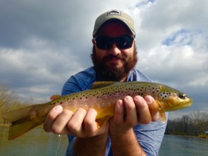 Jake with a Watauga river brown trout while fishing with Huck